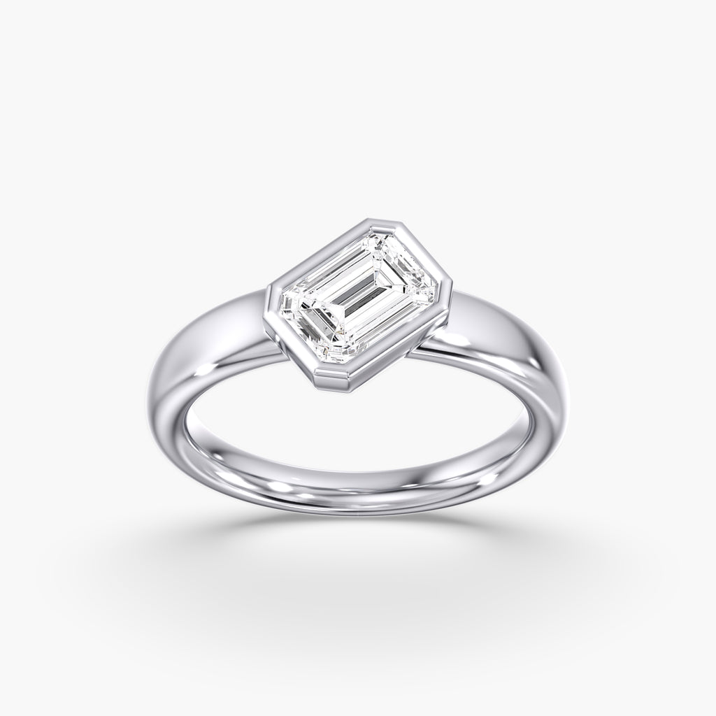 Modern Tilted Emerald Cut Diamond Bezel Ring