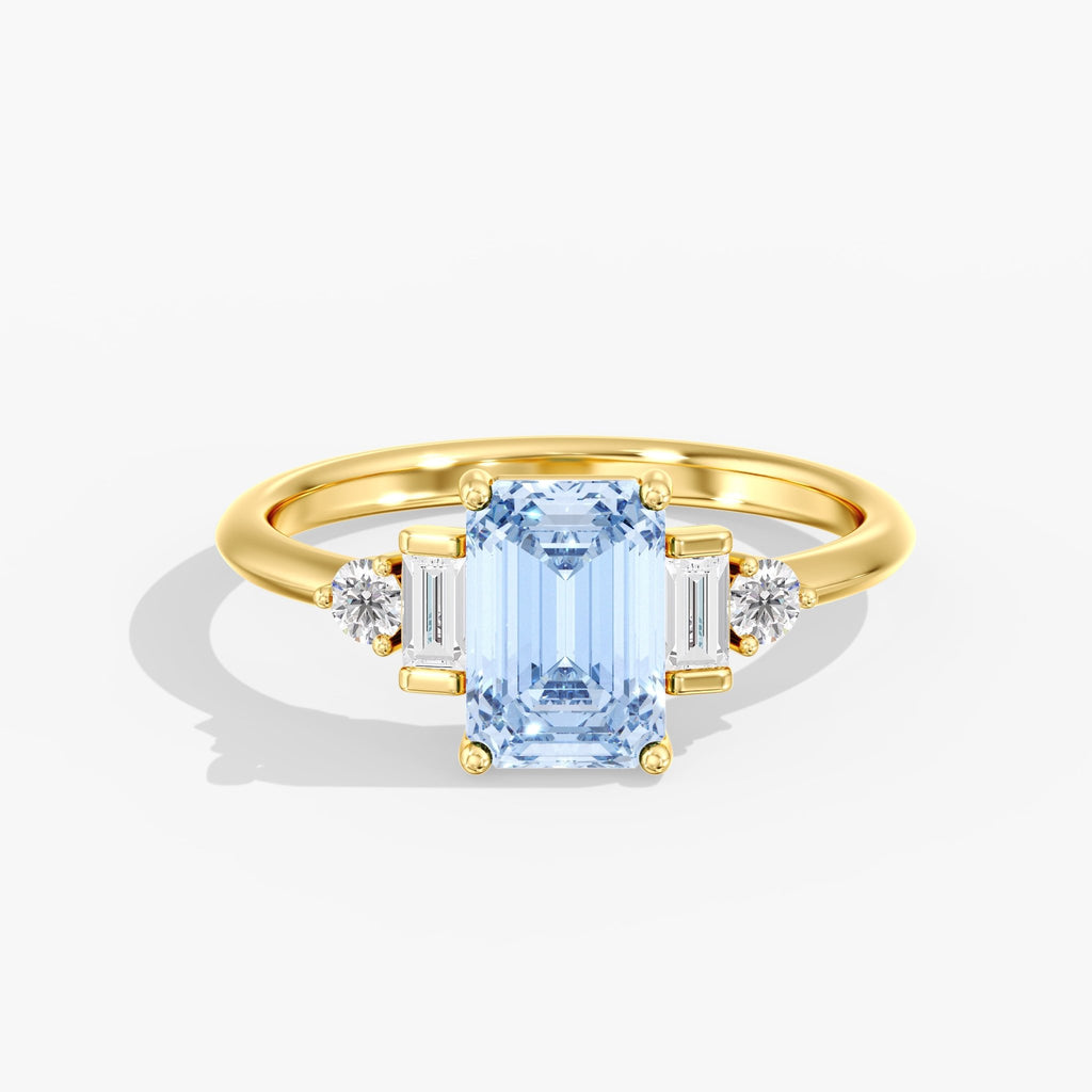 Yellow Gold Blue Emerald Cut 3 Stone Triangle Ring Top View