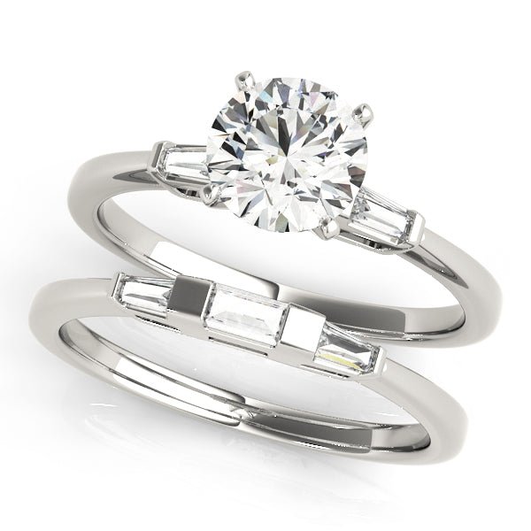 round diamond ring set with baguette emerald cut side stones