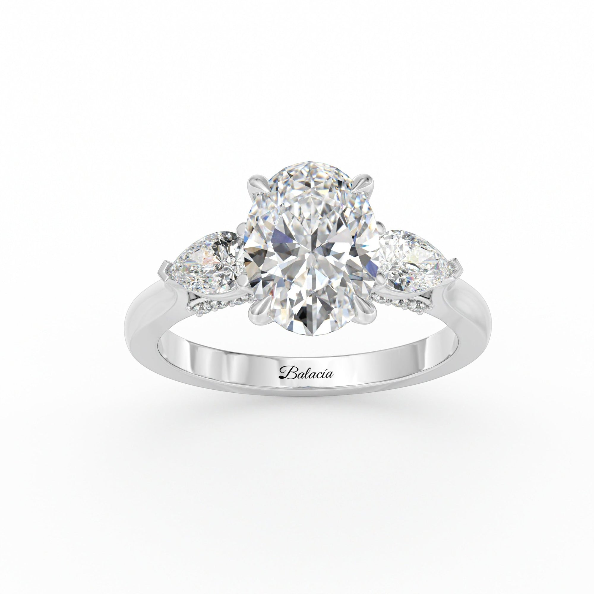 oval engagement ring with pear side diamonds