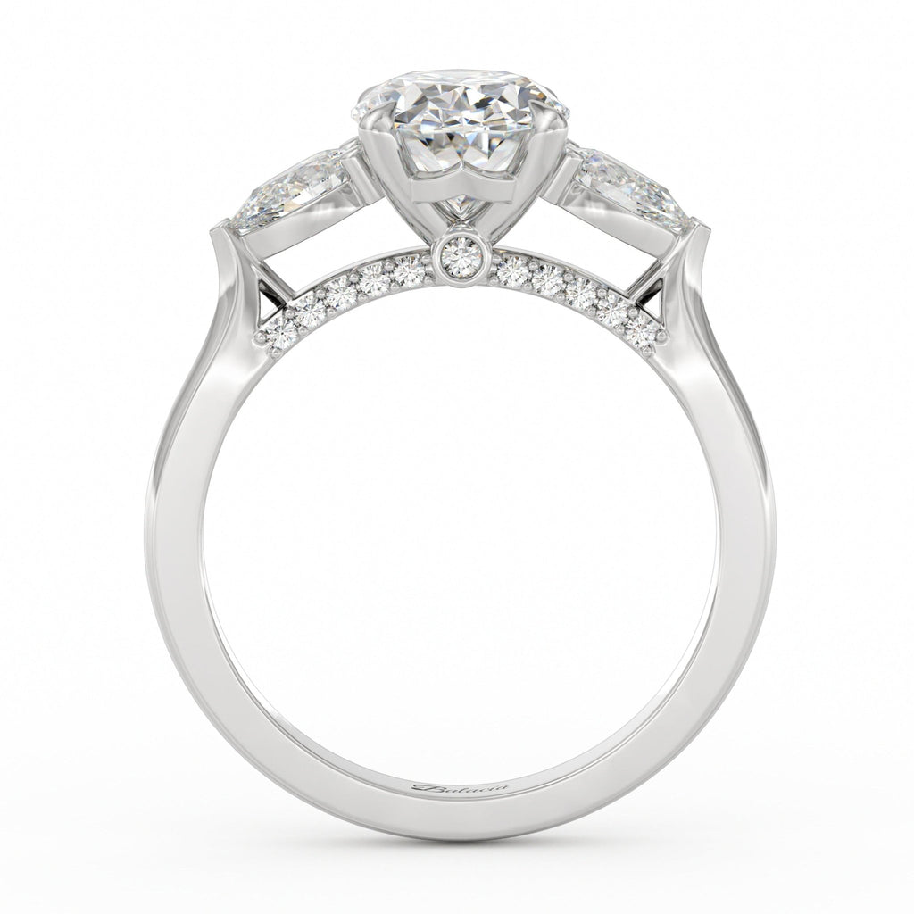 oval engagement ring with pear side diamonds and diamonds on bridge