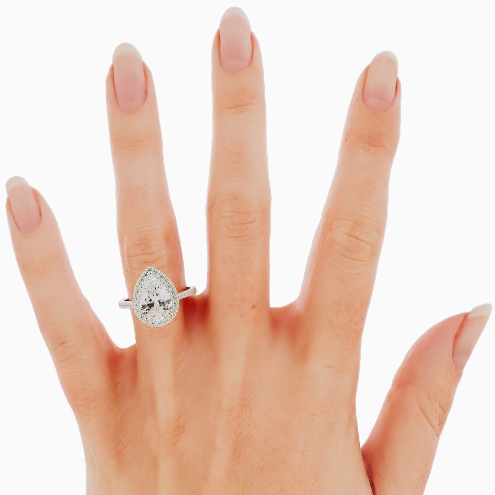 pear engagement ring on hand
