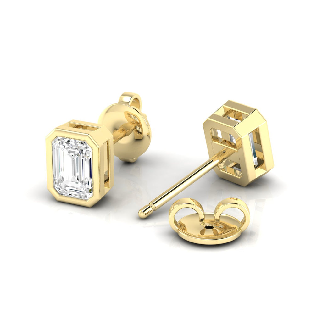 Bezel-set emerald cut diamond stud earrings, featuring sleek and modern design with stunning rectangular diamonds for a sophisticated look | Yellow Gold | Back View