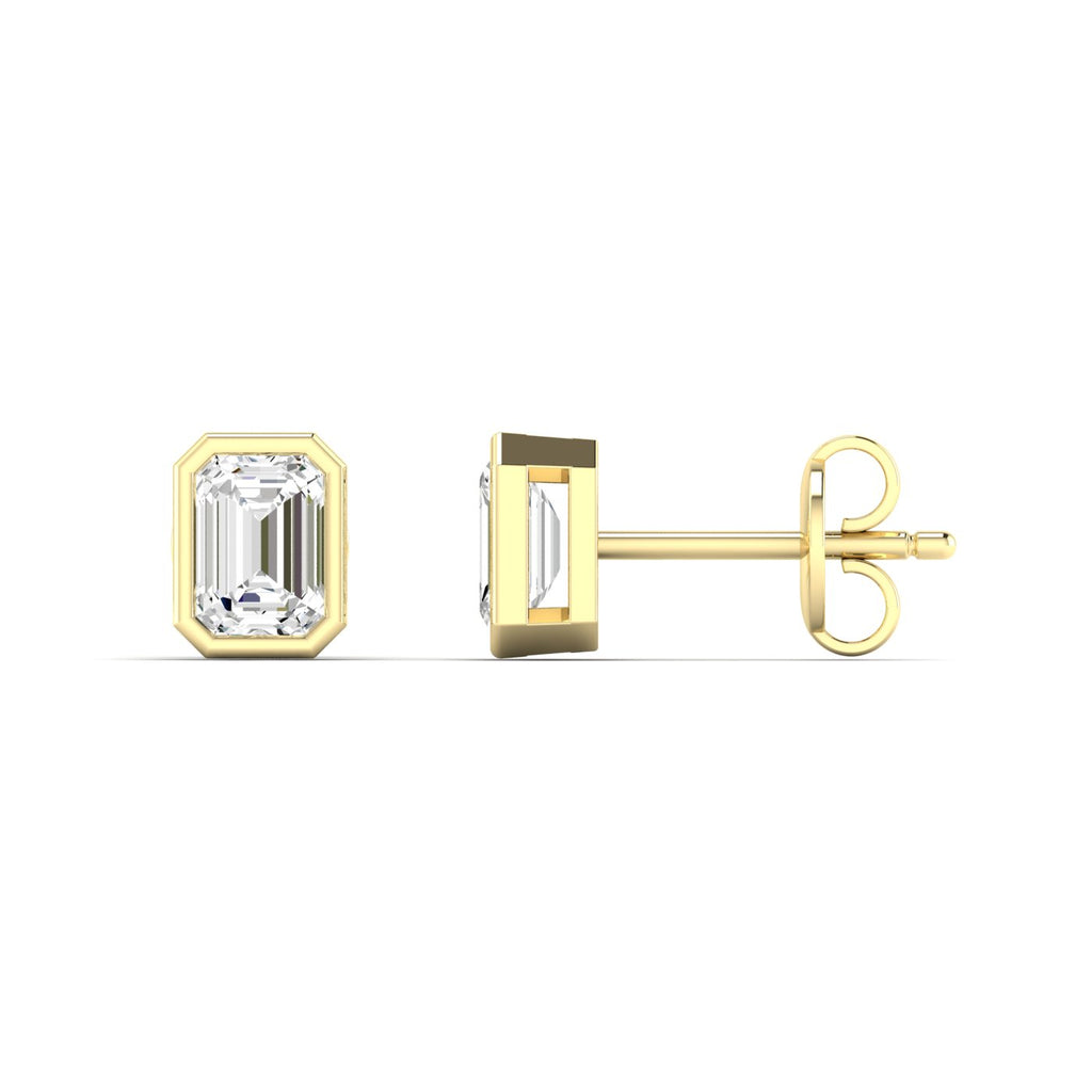 Bezel-set emerald cut diamond stud earrings, featuring sleek and modern design with stunning rectangular diamonds for a sophisticated look | Yellow Gold | Side View