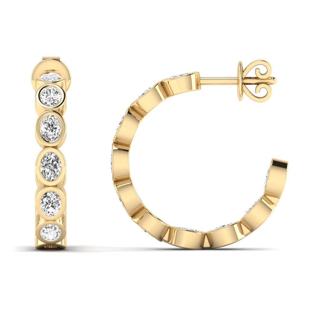 Elegant oval bezel diamond hoop earrings featuring radiant oval diamonds set in sleek bezel settings, offering a modern and sophisticated look | Yellow Gold | Front + Side View