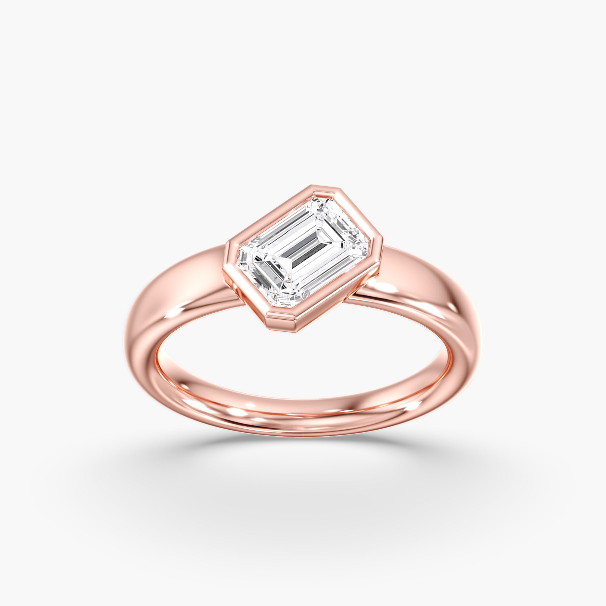 Rose Gold Modern Tilted Emerald Cut Diamond Bezel Ring