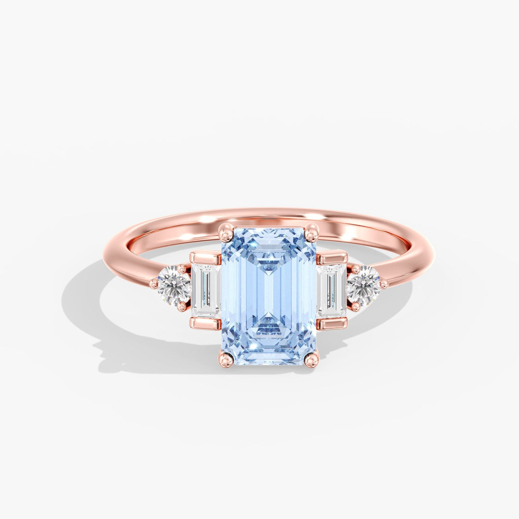 Rose Gold Blue Emerald Cut 3 Stone Triangle Ring Top View