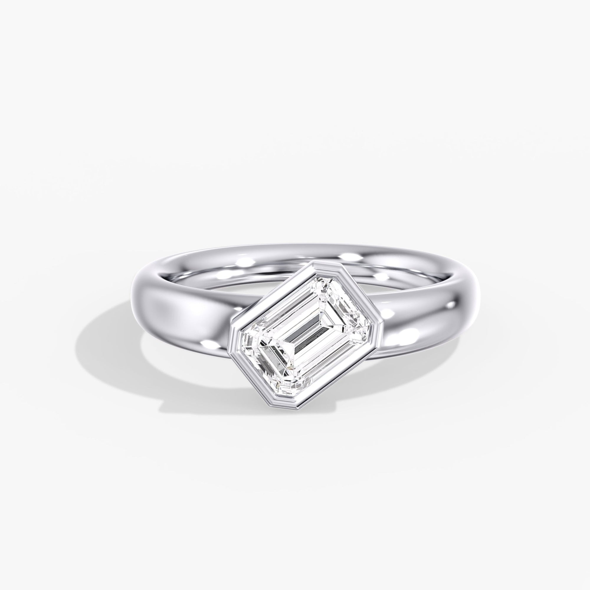 Modern Tilted Emerald Cut Diamond Bezel Ring Front View