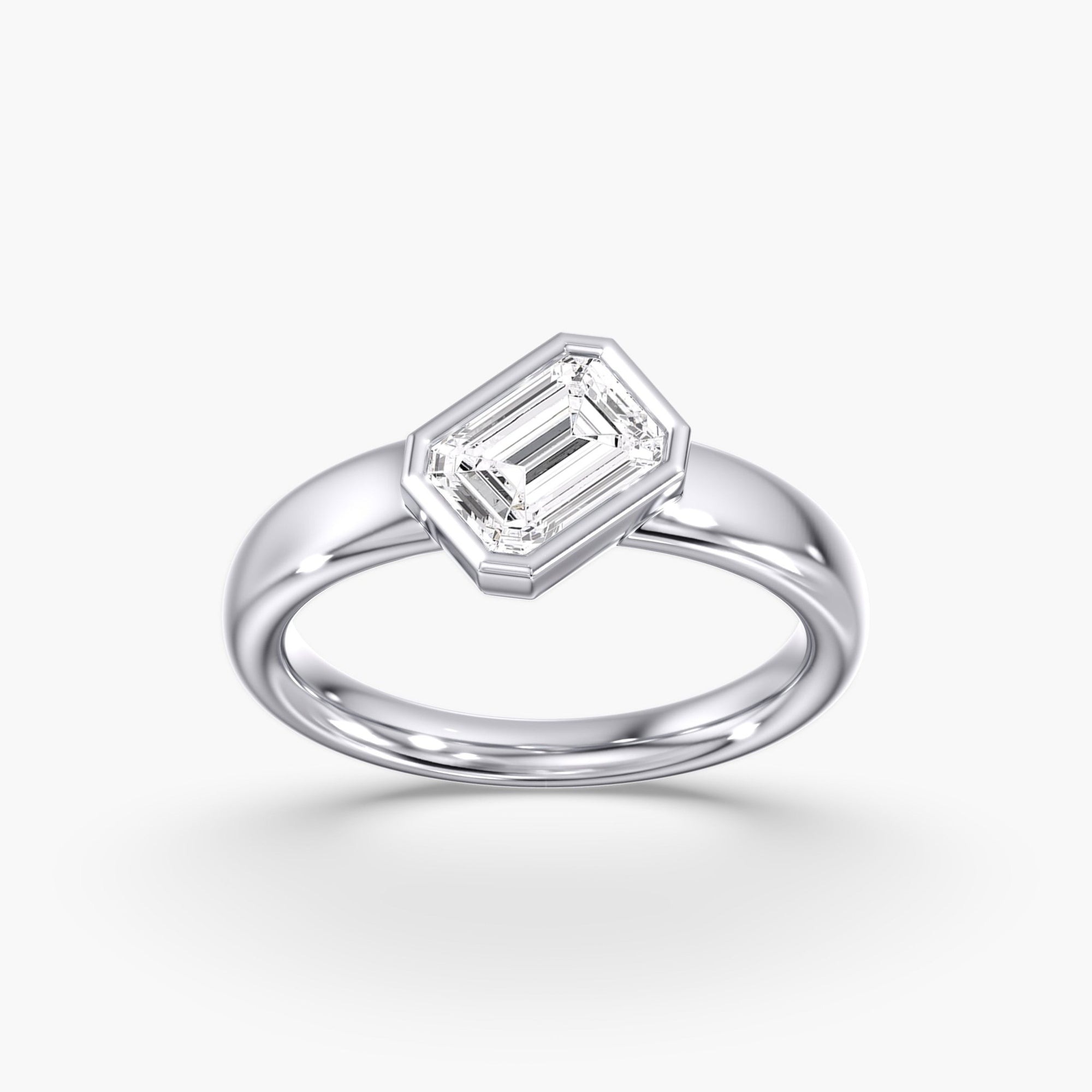 Modern Tilted Emerald Cut Diamond Bezel Ring 