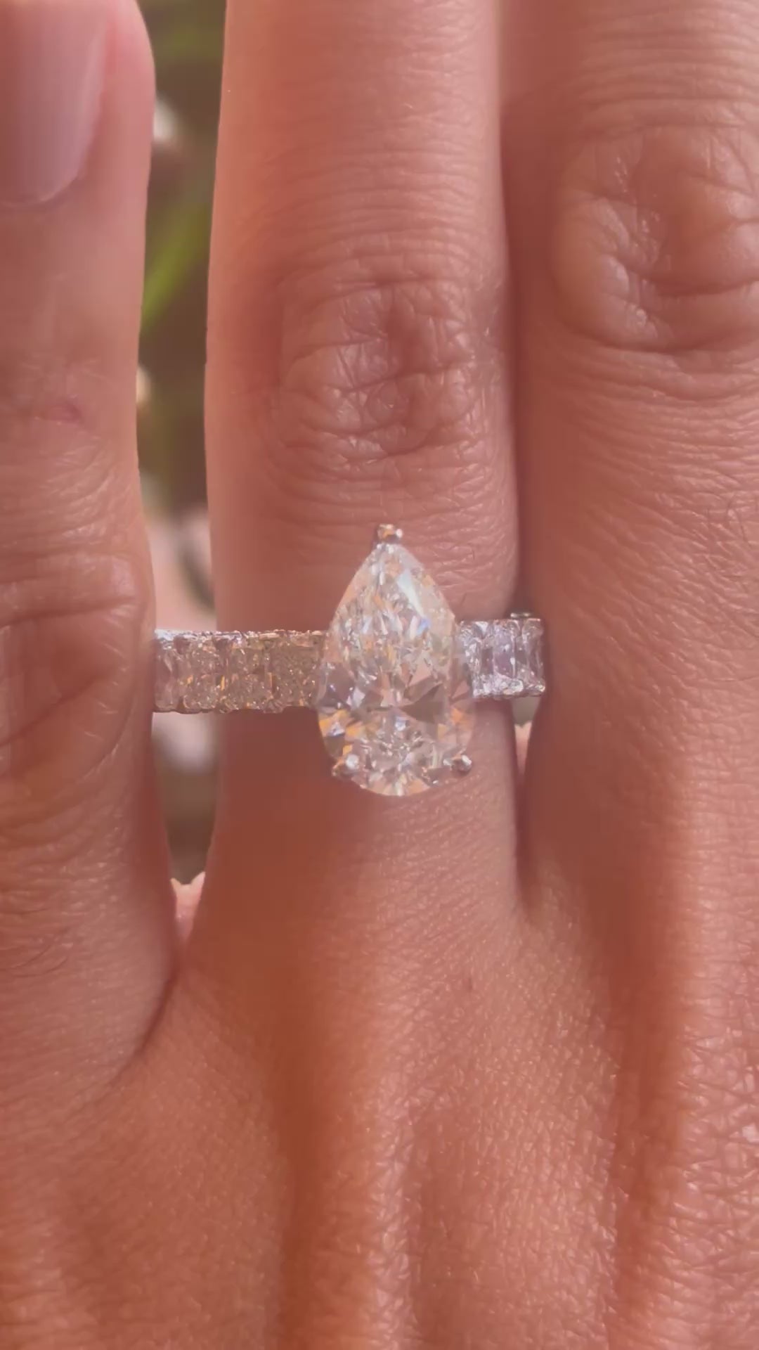 Pear ring on a hand