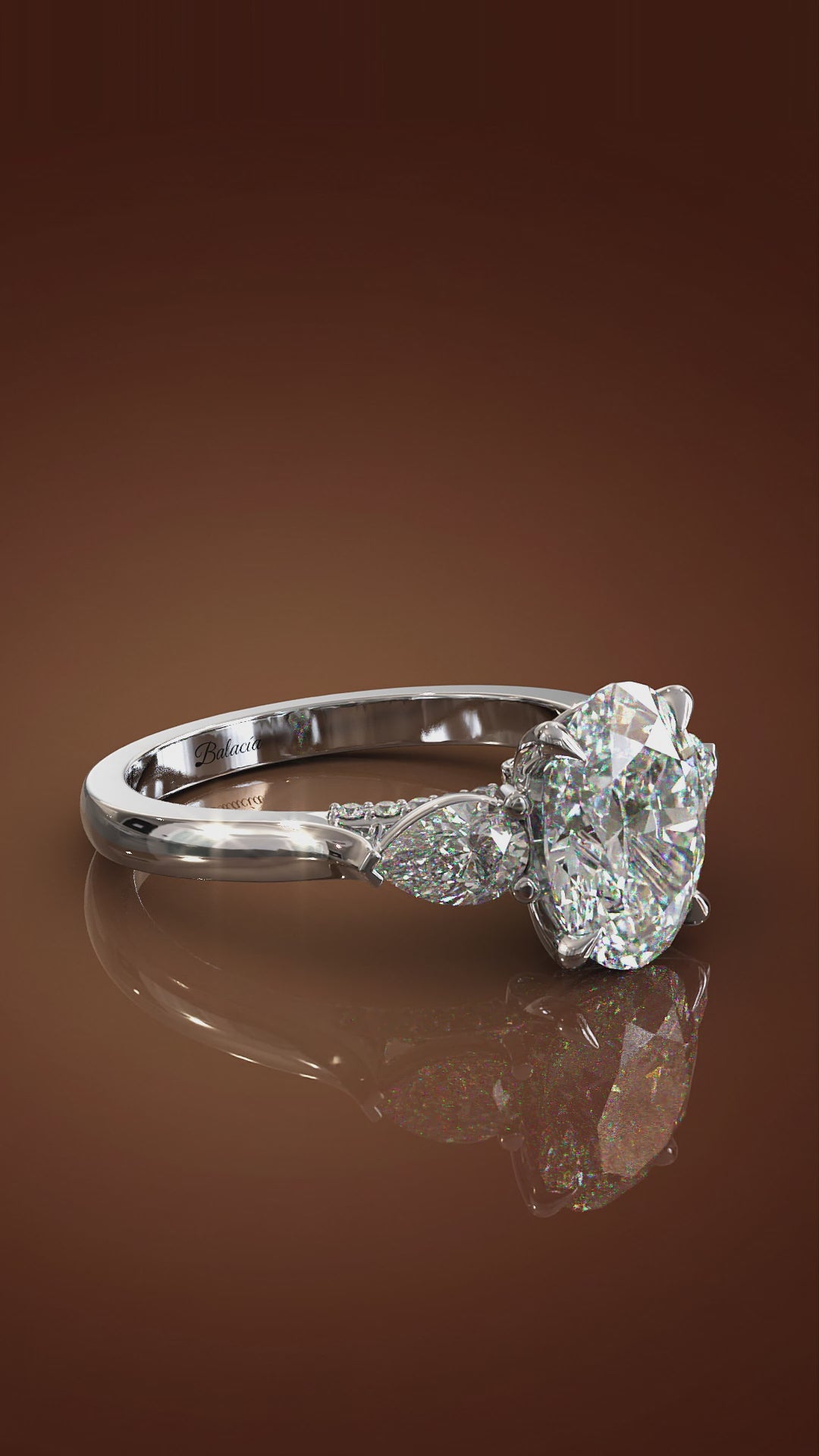 oval engagement ring with pear side diamonds 3 stone ring